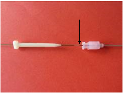 Wire with arrow pointing to mark that indicates adequate level of insertion.