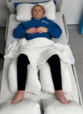 Patient in bed on back